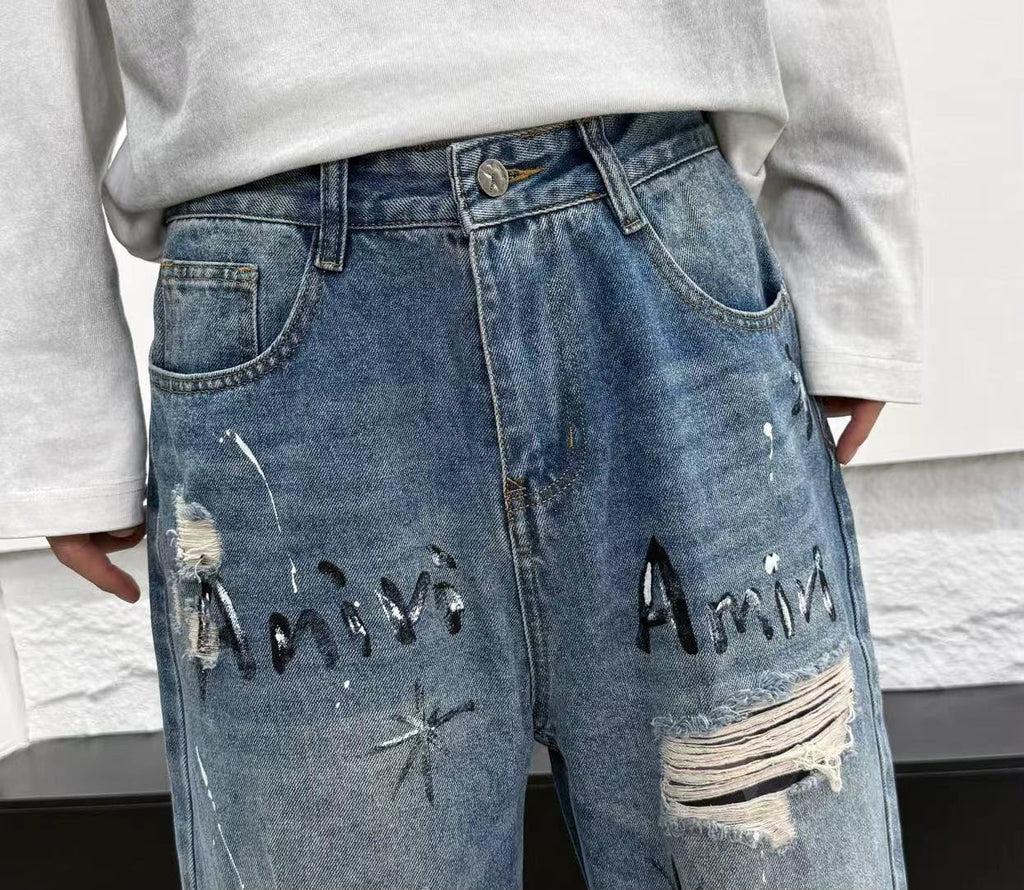 بنطال جينز أميري واسع بستايل ستريت وير وغرافيتي (Amiri Baggy Jeans)